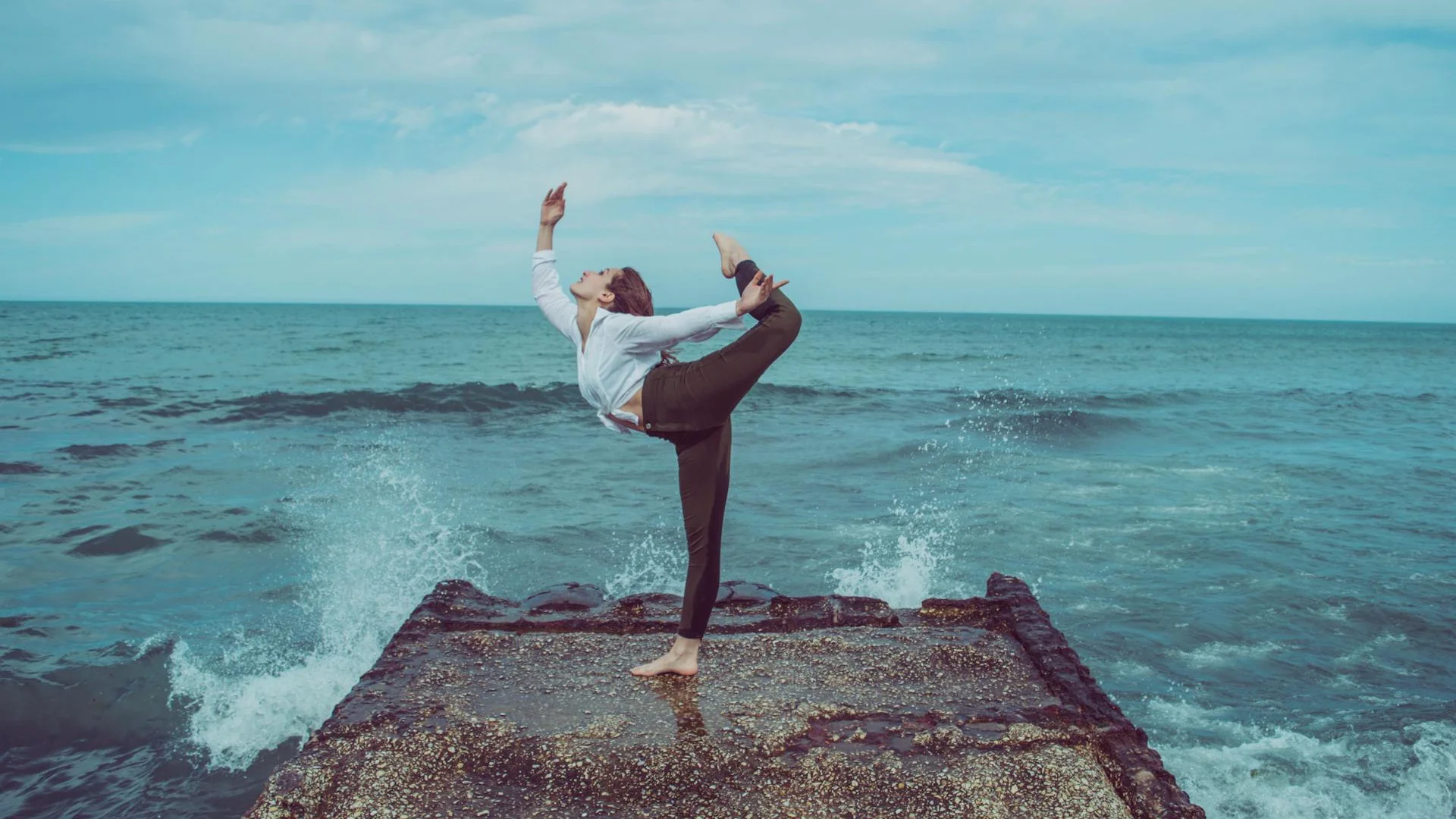 A dancer in a sharp, extended contemporary pose, illustrative of a San Francisco Ballet premiere